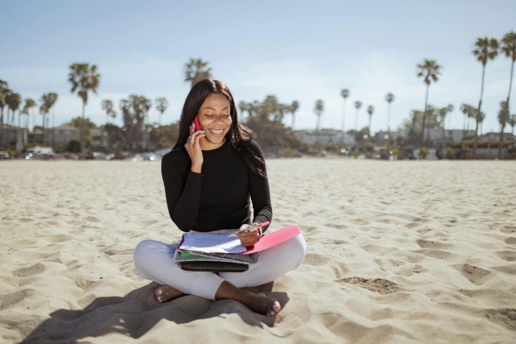 Woman talking on cell phone on the beach - partner